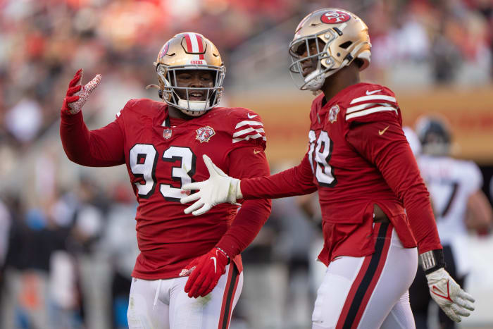 Dec 19, 2021; Santa Clara, California, USA; San Francisco 49ers defensive tackle D.J. Jones (93) celebrates with defensive end Arden Key (98) during the third quarter against the Atlanta Falcons at Levi's Stadium. Mandatory Credit: Stan Szeto-USA TODAY Sports